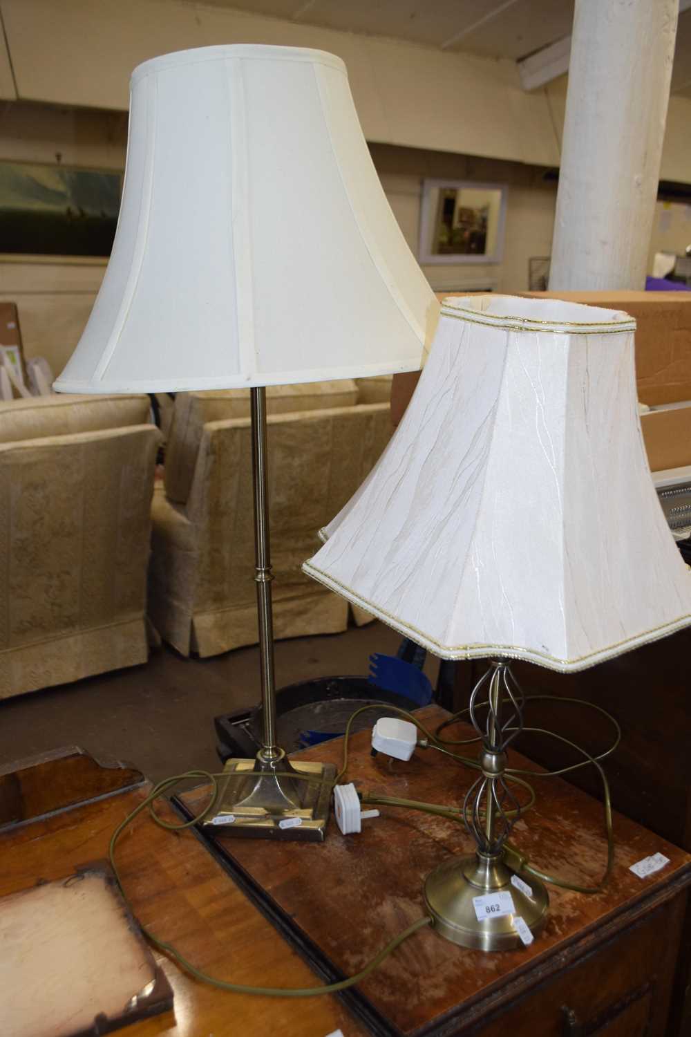 Two brass effect table lamps