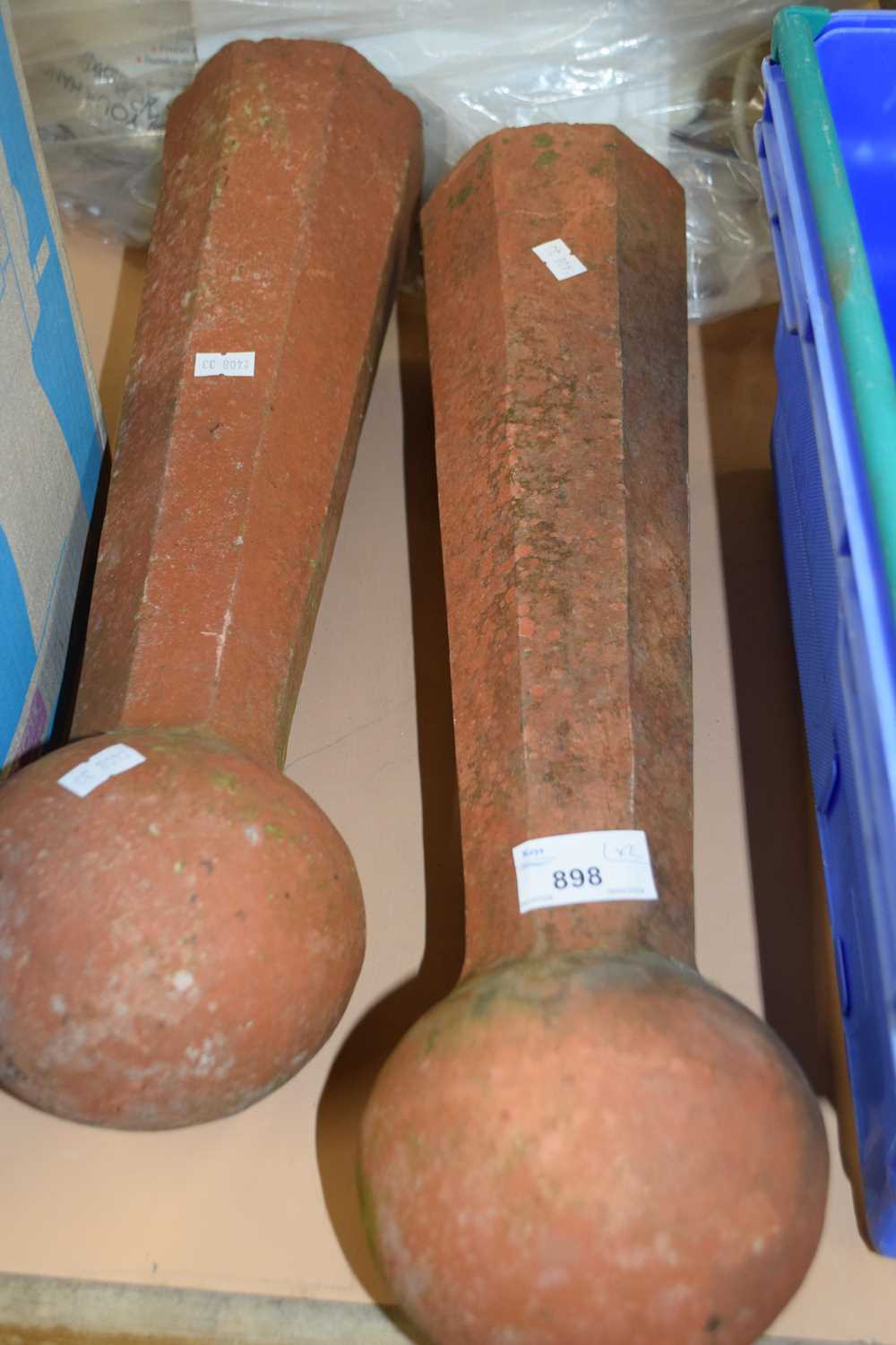 Two terracotta bollards