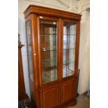 Modern lounge display cabinet with mirrored top section and cupboard base