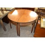 A pair of 19th Century mahogany demi lune tables forming a circular dining table, lacking any