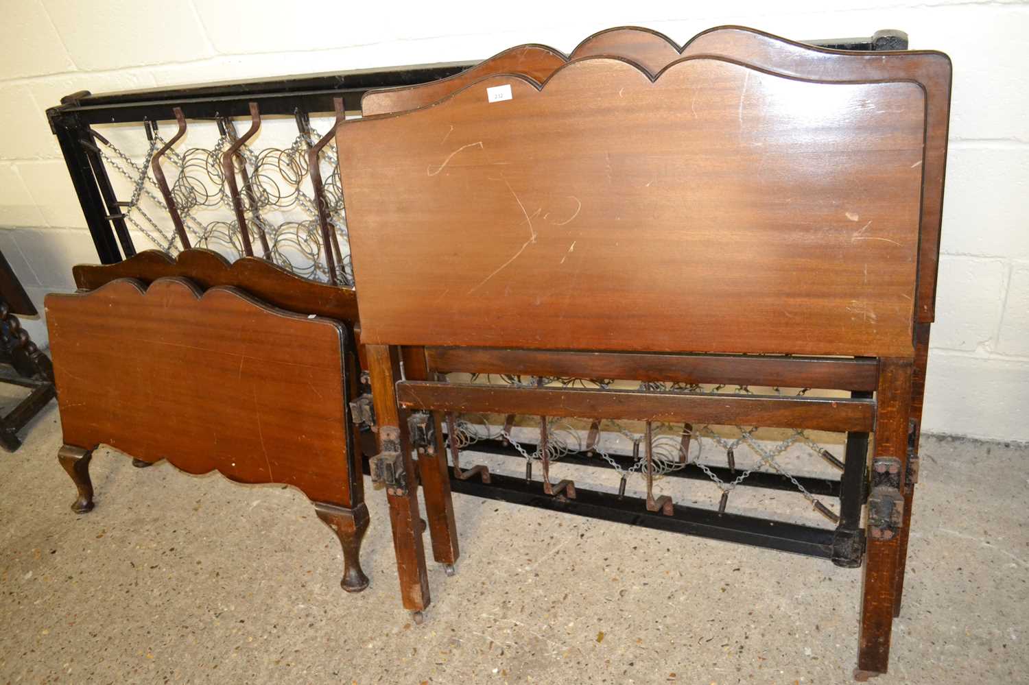 Pair of early 20th Century single bed frames with sprung centres