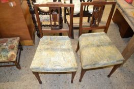 A pair of late 19th Century bedroom chairs with urn carved backs