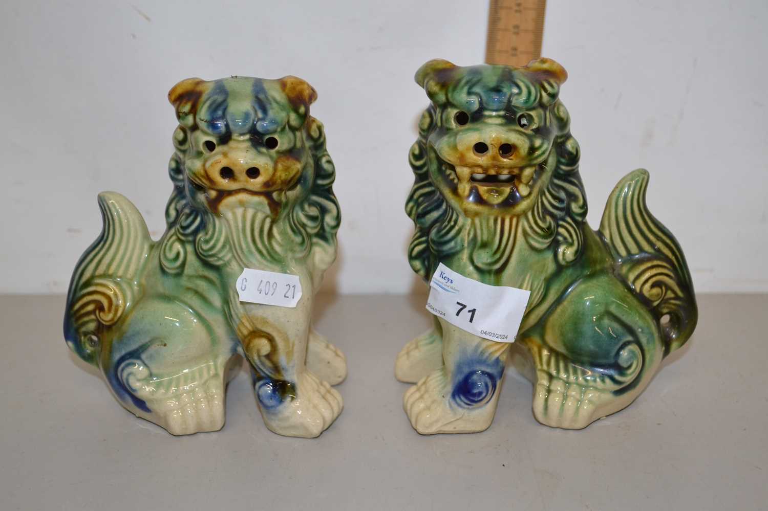 A pair of 20th Century mottled glazed Chinese foo dogs