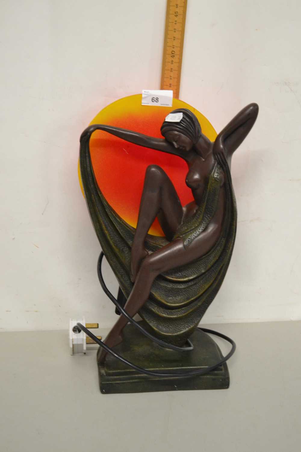 An Art Deco style bronzed resin figural table lamp