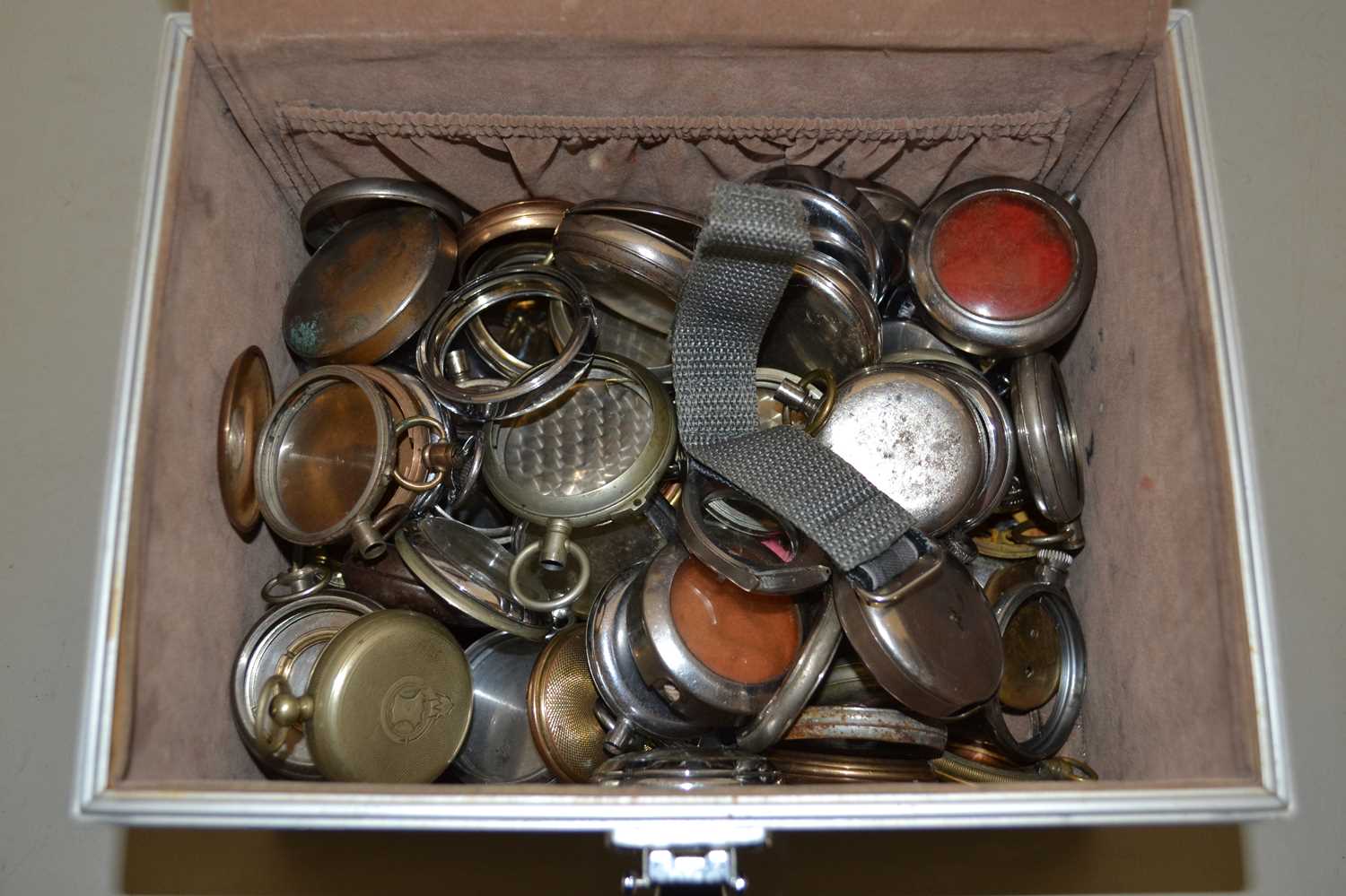 A case of mainly base metal and silver plated pocket watch cases