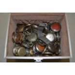 A case of mainly base metal and silver plated pocket watch cases