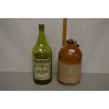 Unbranded stone ware flagon together with a large vintage Martel Cognac bottle (empty)