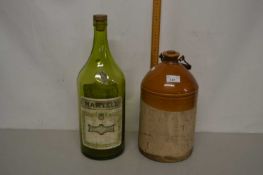 Unbranded stone ware flagon together with a large vintage Martel Cognac bottle (empty)