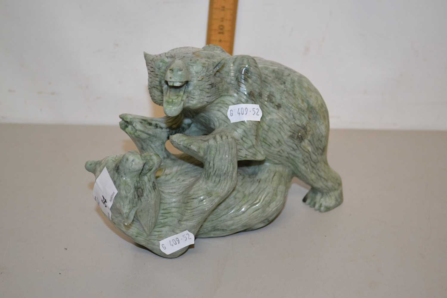 Contemporary polished stone model of two fighting bears