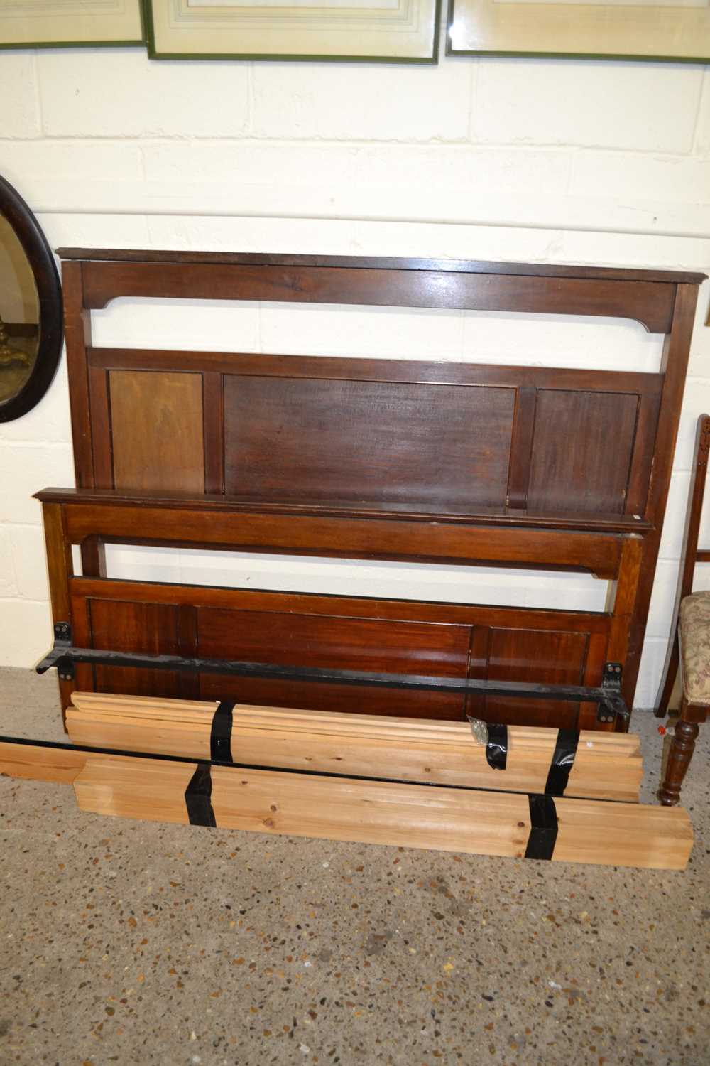 An Edwardian mahogany double bed frame