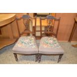 A pair of late Victorian tapestry covered bedroom chairs