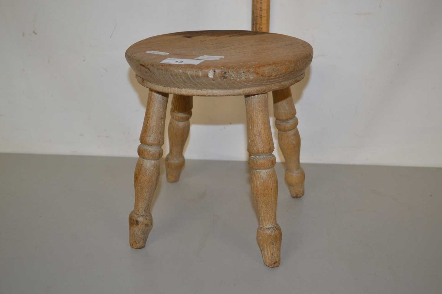 Small turned wooden milking stool