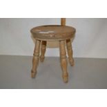 Small turned wooden milking stool