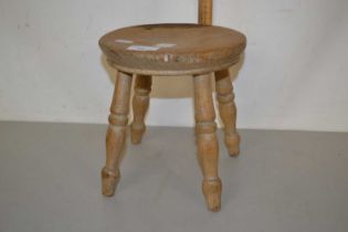 Small turned wooden milking stool