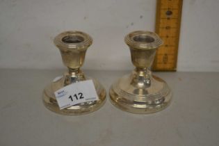 Pair of small silver mounted dressing table candlesticks with loaded bases