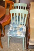 A pair of painted kitchen chairs