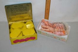 A box of children's Dandy Rhymes Gaming Blocks and a box of vintage miniature dolls