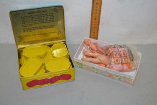 A box of children's Dandy Rhymes Gaming Blocks and a box of vintage miniature dolls