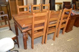 An Indian Sheesham wood rectangular dining table and six chairs, table 180cm long