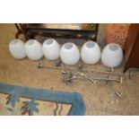 Group of six retro metal framed industrial style ceiling lights with white glass shades