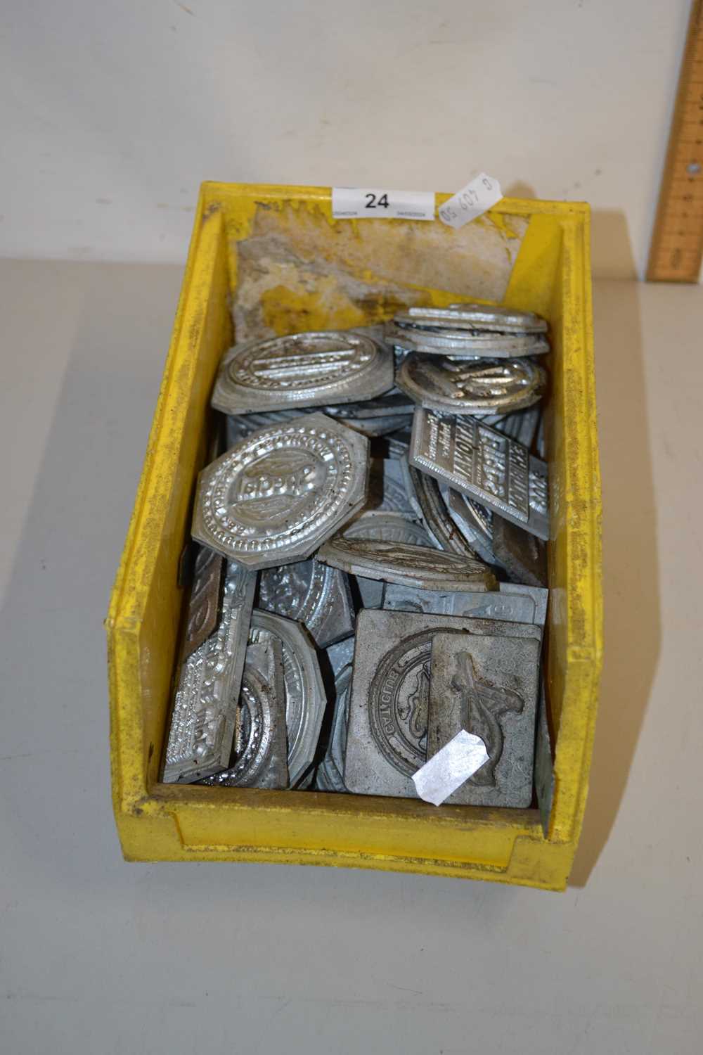 Box of various small printing blocks