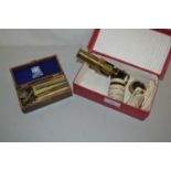 A small brass monocular microscope together with a small quantity of slides