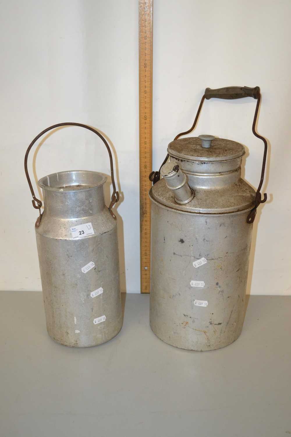 Two small aluminium churns