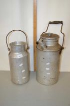 Two small aluminium churns