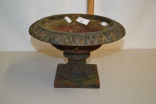 A small cast iron urn