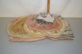 A collection of various floral table mats and covers