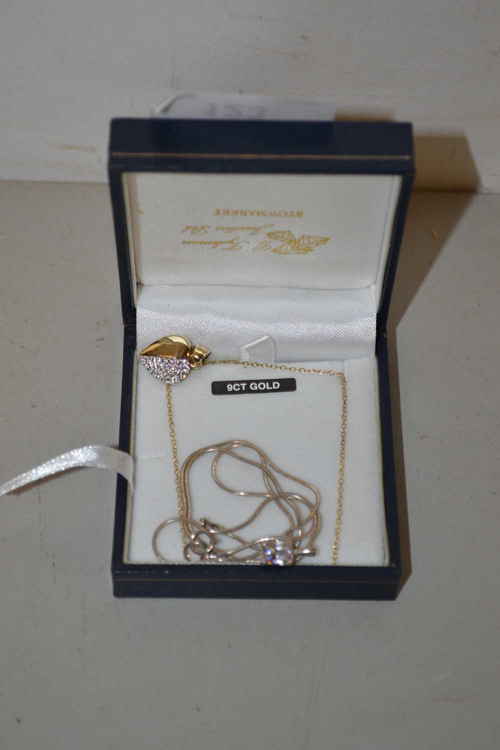 A silver and 9ct bonded gold heart pendant on chain plus a further small necklace