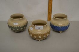 Group of three Royal Doulton cauldron style vases with floral decorations