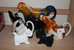 Cow creamers, cockerel jug and a pair of terrier salt and peppers