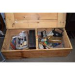 A low wooden storage box and assorted household contents, tools etc