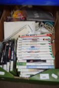 Box containing a Nintendo Wii, with various games and accessories