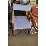 A canvas seated folding chair