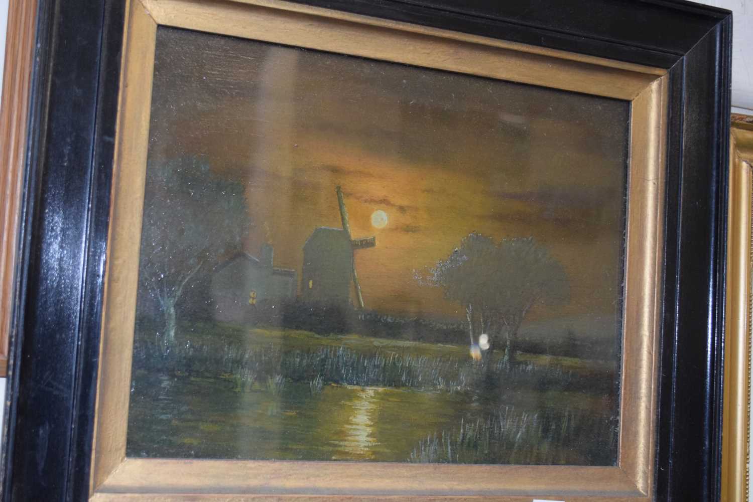 Late 19th or early 20th Century study of a moonlit scene with windmill, oil on board, set in