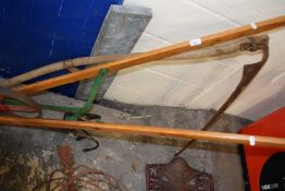 Wooden framed push harrow together with a vintage scythe