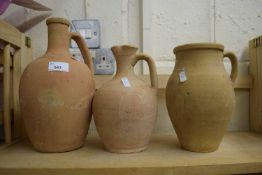 Three terracotta jugs