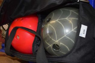 Two bowling balls and bag