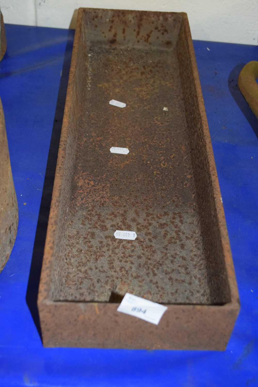 Small rectangular cast iron trough