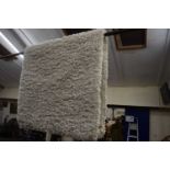 A Dunelm Slumber Ivory rug, 80 x 150cm