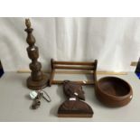 An oak table lamp together with a further book rack, circular bowl and a carved wood bust