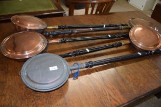 Group of five various copper bed warming pans