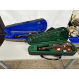 Two cased violins