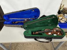 Two cased violins