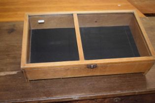 A wedge formed table top display cabinet