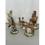 A group of modern Italian bisque porcelain figurines