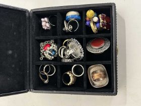 Small case with various costume jewellery rings