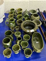 Collection of green glazed Holkham Pottery items